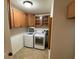 Laundry room features a washer, dryer, and built-in storage at 132 Peckham Se St, Port Charlotte, FL 33952
