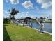 Private boat dock with lift and covered area at 132 Peckham Se St, Port Charlotte, FL 33952