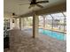 Screened pool and patio area with brick pavers at 132 Peckham Se St, Port Charlotte, FL 33952