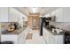 White kitchen cabinets and granite countertops at 8227 Rhanbuoy Rd, Spring Hill, FL 34606