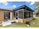 Exterior view of screened porch at 8227 Rhanbuoy Rd, Spring Hill, FL 34606