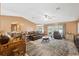 Spacious living room with leather furniture and wood floors at 8227 Rhanbuoy Rd, Spring Hill, FL 34606