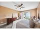 Bedroom with a queen bed, dresser, and access to patio at 8227 Rhanbuoy Rd, Spring Hill, FL 34606