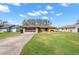 Single-story house with driveway and lawn at 8227 Rhanbuoy Rd, Spring Hill, FL 34606