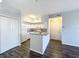 Modern kitchen with granite countertop and white cabinets at 4138 Central Sarasota Pkwy # 1524, Sarasota, FL 34238