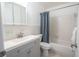 Clean bathroom with gray vanity, white tub, and shower at 8320 112Th St # 104, Seminole, FL 33772