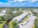 Aerial view of condo building near lake and road at 8320 112Th St # 104, Seminole, FL 33772