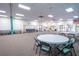 Community room with round tables and chairs at 8320 112Th St # 104, Seminole, FL 33772