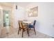 Dining area with white table and mid-century chairs at 8320 112Th St # 104, Seminole, FL 33772