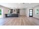 Open concept living area with wood-look flooring at 1227 Arden Ave, Clearwater, FL 33755