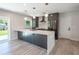 Sleek kitchen island with white quartz countertops and dark cabinetry at 1227 Arden Ave, Clearwater, FL 33755