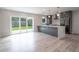 Modern kitchen with island, stainless steel appliances and backyard view at 1227 Arden Ave, Clearwater, FL 33755