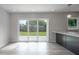 Glass sliding doors open to backyard from kitchen area at 1227 Arden Ave, Clearwater, FL 33755