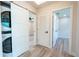 Bright hallway with doors to bedrooms and laundry area at 1227 Arden Ave, Clearwater, FL 33755