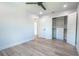 Bedroom with ceiling fan, double door closet and built-in shelves at 1227 Arden Ave, Clearwater, FL 33755