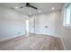 Bedroom with ceiling fan, double door closet and built-in shelves at 1227 Arden Ave, Clearwater, FL 33755