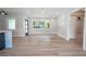 Spacious living room featuring light walls and wood-look floors at 1227 Arden Ave, Clearwater, FL 33755