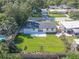 Aerial view of a renovated home with a large backyard, showcasing curb appeal and neighborhood context at 1227 Arden Ave, Clearwater, FL 33755
