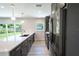 Modern kitchen with stainless steel appliances and quartz countertops at 1227 Arden Ave, Clearwater, FL 33755