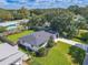 Aerial view of a beautifully landscaped home with a large backyard at 1227 Arden Ave, Clearwater, FL 33755