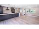 Bright and airy living room with wood-look flooring at 1227 Arden Ave, Clearwater, FL 33755