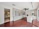 Spacious home office with built-in shelving and hardwood floors at 6775 Timberland Ln, Sarasota, FL 34241