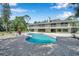 Kidney-shaped pool with brick patio at 6775 Timberland Ln, Sarasota, FL 34241