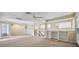 Open loft area with built-in shelving and carpet flooring at 6775 Timberland Ln, Sarasota, FL 34241
