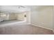 Bright bonus room with carpet and access to a balcony at 6775 Timberland Ln, Sarasota, FL 34241