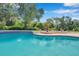 Relaxing pool area with lush landscaping at 6775 Timberland Ln, Sarasota, FL 34241