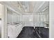 Bathroom with marble vanity and mirrored walls at 6775 Timberland Ln, Sarasota, FL 34241