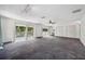 Spacious bedroom with wall-to-wall carpeting and access to a balcony at 6775 Timberland Ln, Sarasota, FL 34241