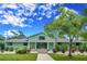 Green house exterior with walkway and landscaping at 6775 Timberland Ln, Sarasota, FL 34241