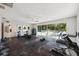 Home gym with equipment and sliding doors to the pool area at 6775 Timberland Ln, Sarasota, FL 34241