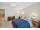 Second bedroom with a queen bed and plenty of natural light at 6775 Timberland Ln, Sarasota, FL 34241