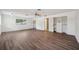 Spacious bedroom with wood-look floors and ample closet space at 6775 Timberland Ln, Sarasota, FL 34241