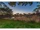Sunset view over a tranquil pond and surrounding landscape at 2156 Masters Ct # 2156, Dunedin, FL 34698