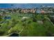 Aerial perspective showcasing waterfront and golf course at 2156 Masters Ct # 2156, Dunedin, FL 34698