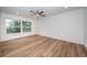Well-lit bedroom with laminate flooring and a window at 2156 Masters Ct # 2156, Dunedin, FL 34698