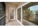 Private balcony with sliding glass doors and tile flooring at 2156 Masters Ct # 2156, Dunedin, FL 34698