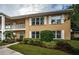 Condo building exterior with landscaping and walkway at 2156 Masters Ct # 2156, Dunedin, FL 34698
