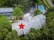Aerial view of condo building, pool, and surrounding landscape at 2156 Masters Ct # 2156, Dunedin, FL 34698