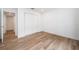 Bright bedroom with wood-look floors and double door closet at 2156 Masters Ct # 2156, Dunedin, FL 34698