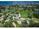 Aerial view of community, showing buildings, landscaping, and golf course at 2156 Masters Ct # 2156, Dunedin, FL 34698