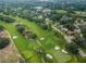 Aerial view of lush golf course with fairways and greens at 2156 Masters Ct # 2156, Dunedin, FL 34698