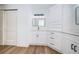 Bright bathroom featuring a vanity with storage and a walk-in shower at 2156 Masters Ct # 2156, Dunedin, FL 34698