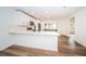 Modern kitchen with white cabinets and island at 2156 Masters Ct # 2156, Dunedin, FL 34698