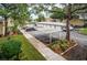 Community parking with covered carport and ample guest parking at 2156 Masters Ct # 2156, Dunedin, FL 34698