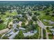 Aerial view of condo community near golf course with pool at 2156 Masters Ct # 2156, Dunedin, FL 34698