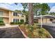 Condo building exterior with landscaping and parking at 2156 Masters Ct # 2156, Dunedin, FL 34698